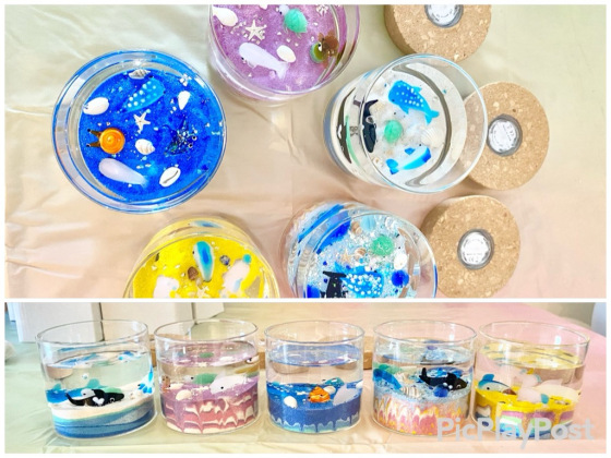 Colorful ocean-themed Glass Figurine Decor Candles created by children during the Kids Workshop at Ocean Decor Candles Gold Coast, featuring miniature sea creatures, shells, and layered sand art designs.